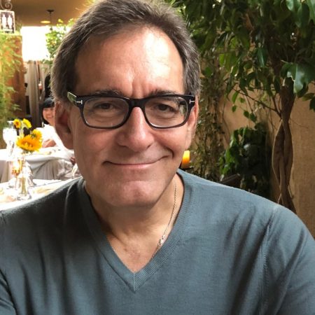 Scott Ponaman, president of Ponaman Healthcare Consulting, smiling in a casual setting, showcasing his approachable demeanor and commitment to compassionate healthcare.